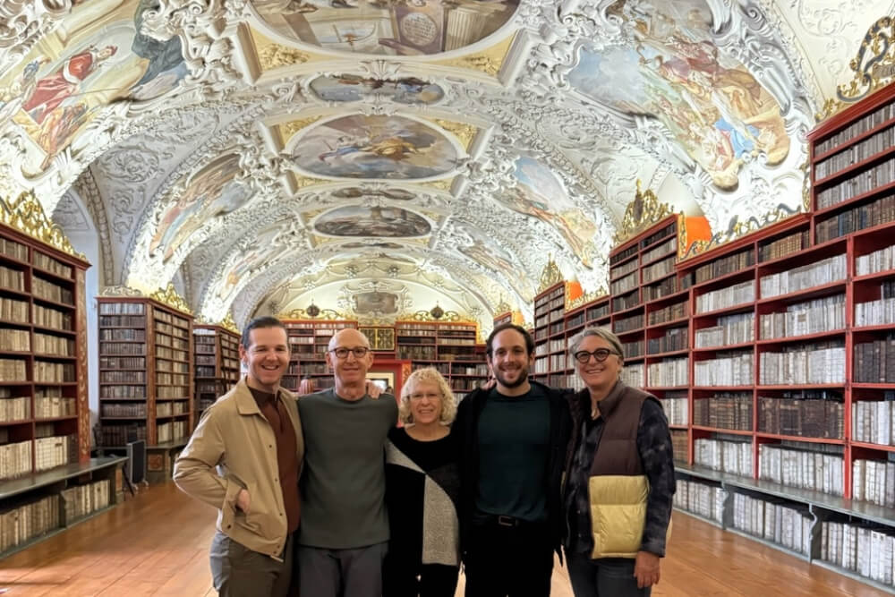 Robin and Josh Madden, and family in the library of the Strahov Monastery in Prague.