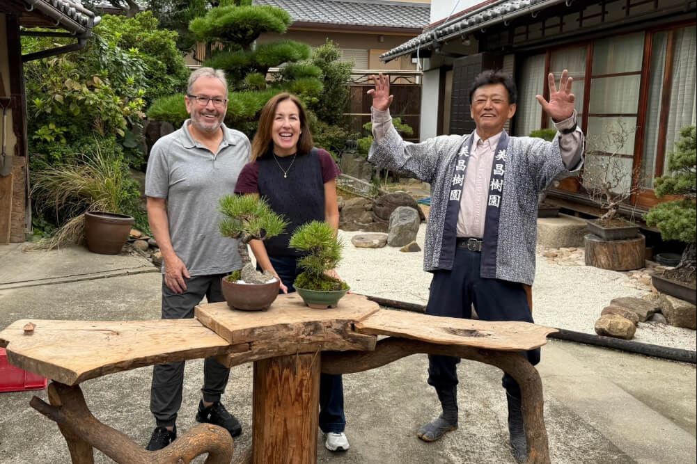 Melissa Hames and her husband learning to create bonsai trees at a workshop in Japan.