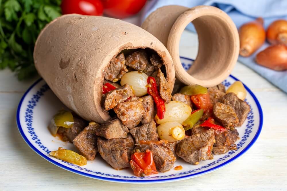 Turkish testi kebabi cooked in ceramic urn.