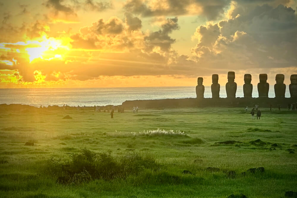 Sunrise over Moai statues at the Easter Island.