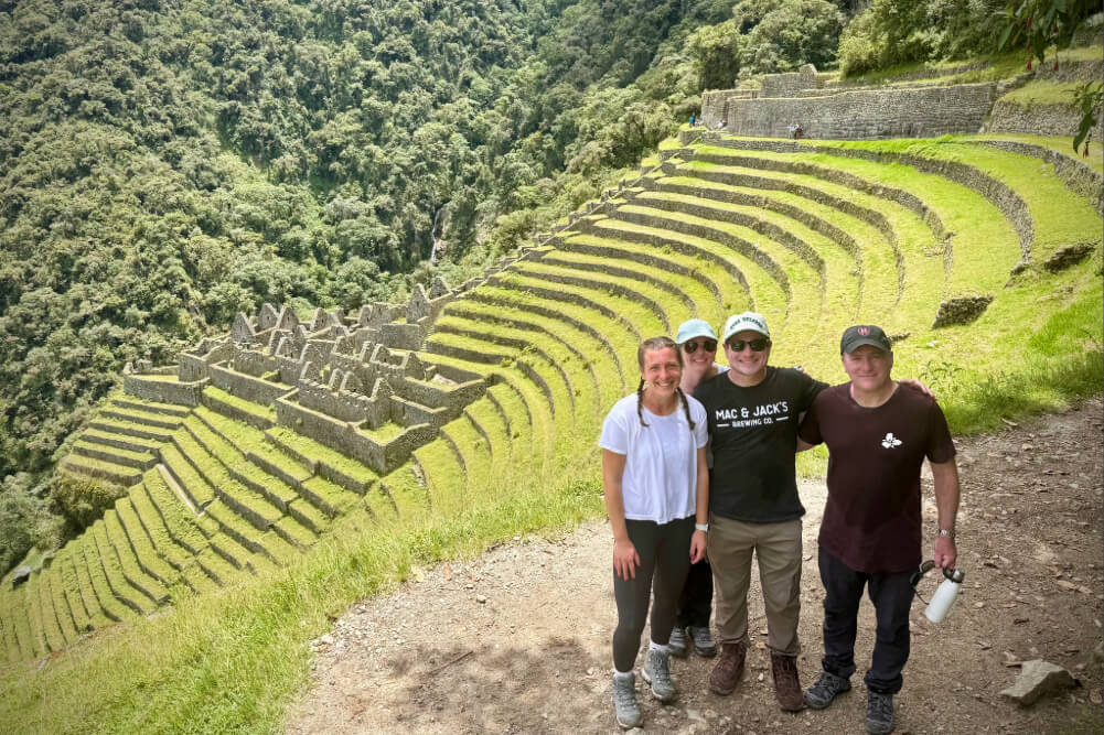 Katie, Ann Marie, Jack and Chris Bell standing above the Inca site Wiñay Wayna in Peru.