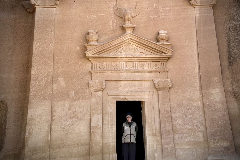 Jeannie Mullen at the entrance to one of the tombs in Hegra, Saudi Arabia.