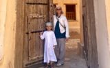Milinda Martin and a local boy in Nizwa Fort, Oman.