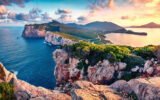 Sunrise over Cape Caccia in Sardinia, Italy.