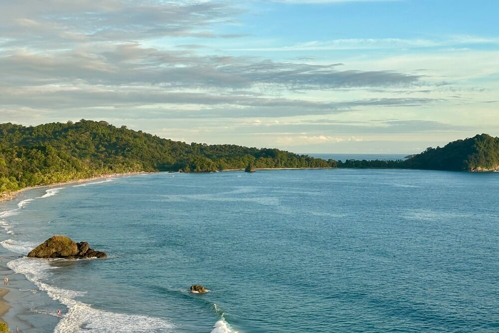 View of a beach from the hotel balcony at Arenas Del Mar in Manuel Antonio.