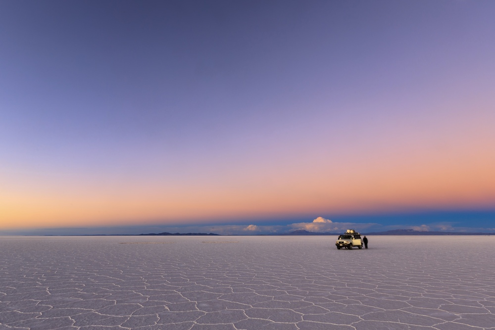Colorful sunset on the Uyuni Saline (Salar de Uyuni), Aitiplano, Bolivia.