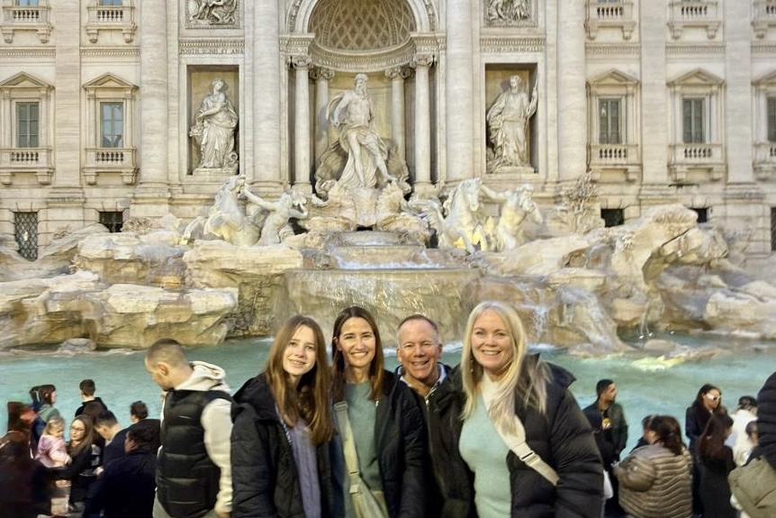 Trisha Mortier and family at the Trevi Fountain in Rome, Italy.