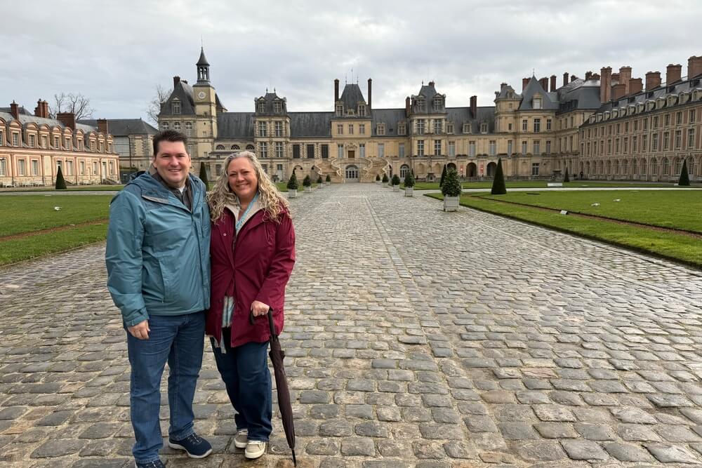 Christine Stephenson and her husband at Château de Fontainebleau in France.