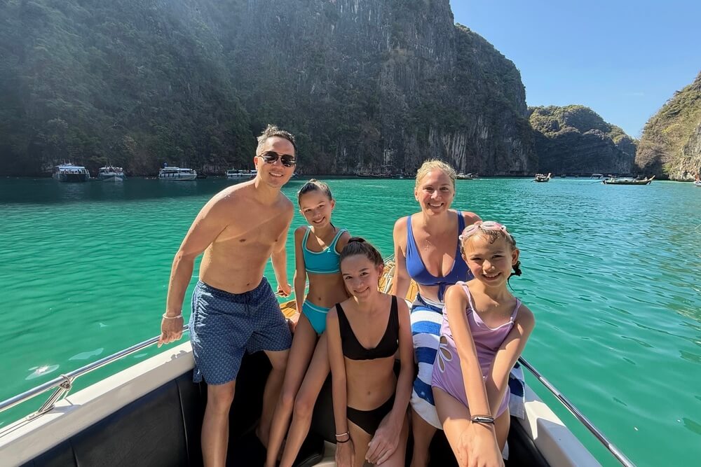 Mary Ko and family exploring islands by boat in Thailand.