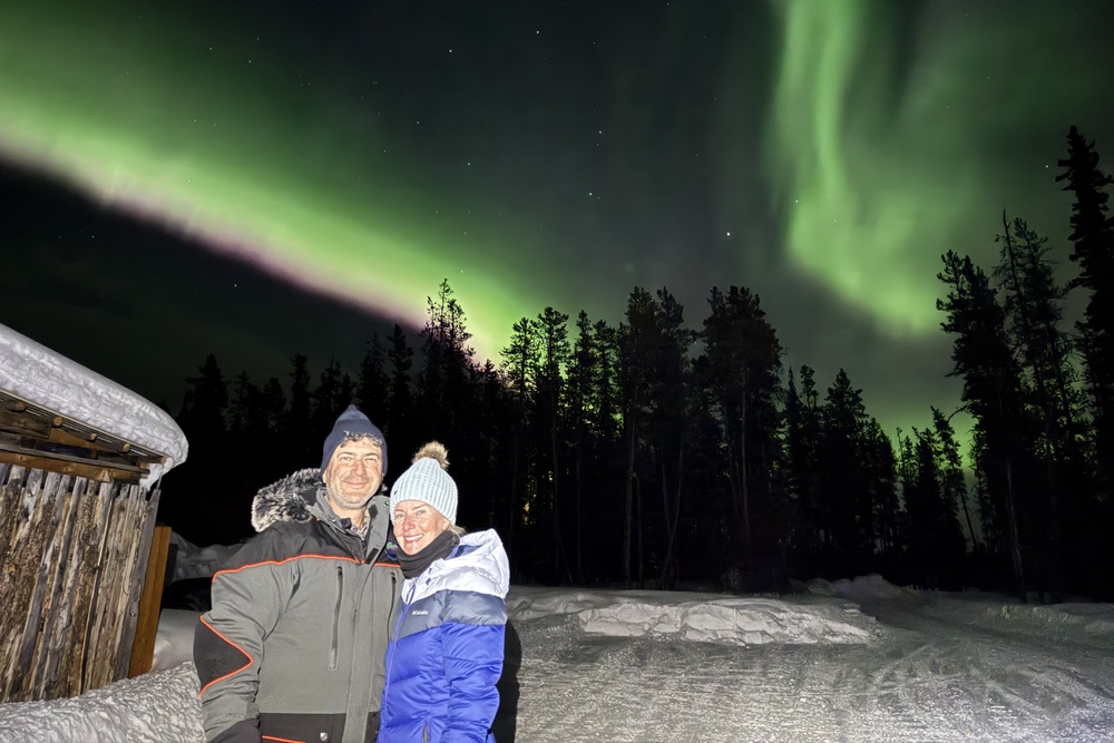 Tina and Marty Sarafa with Northern Lights in the background.