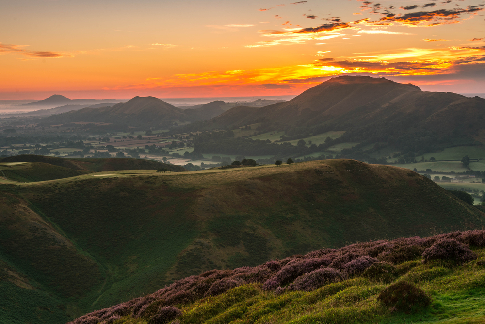 Sunset views of fields and hills atop the Long Mynd, Shropshire, England.