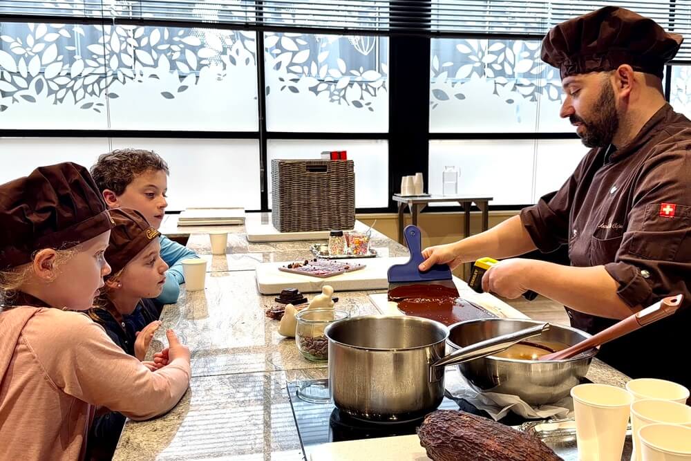 Kids learning chocolate making at Cailler in Switzerland.