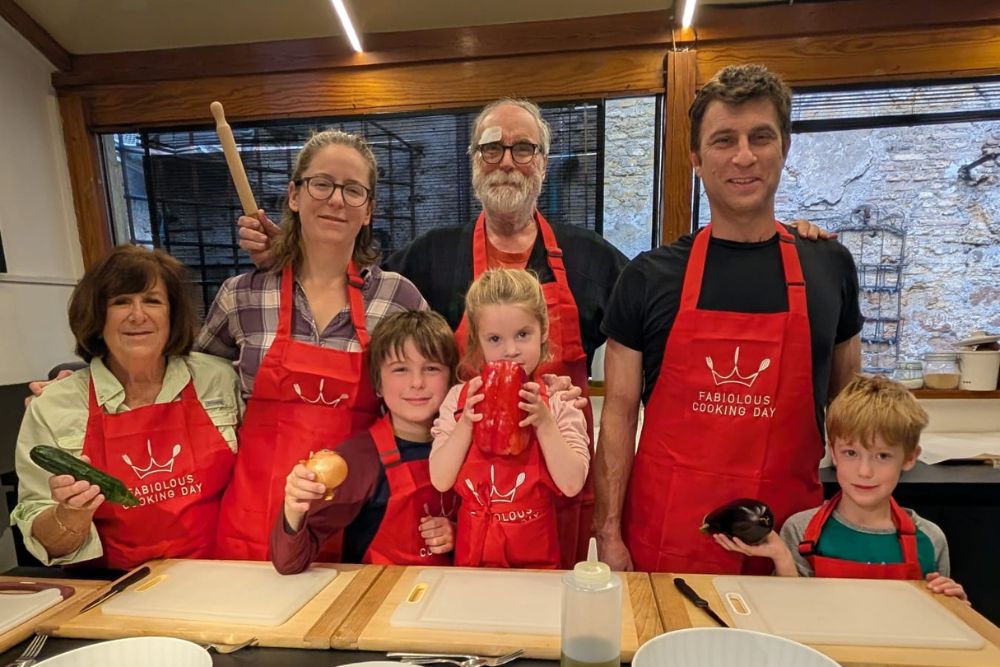 Jan Heininger and her family with little kids at their pizza-making class in Italy.