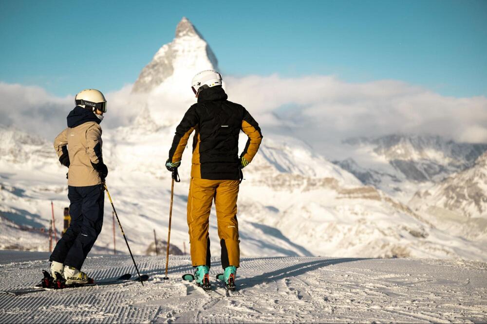 Two people skiing on Matterhorn mountain in Switzerland.