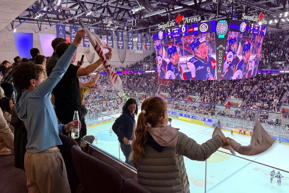 People watching hockey at Swiss Life Arena in Switzerland.