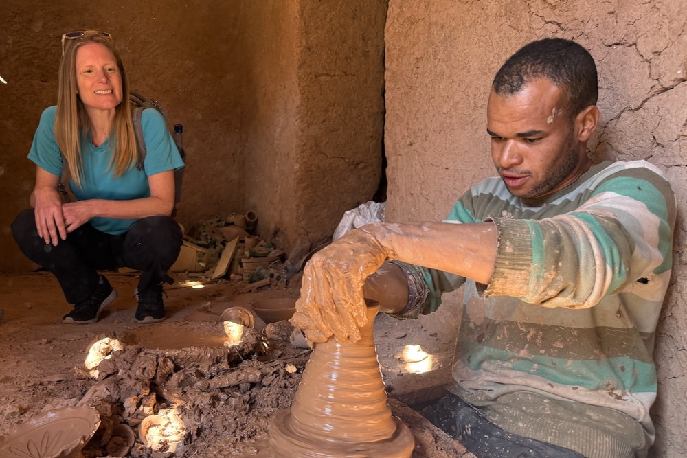 Brook Wilkinson watching a potter at work in Tamegroute, Morocco.