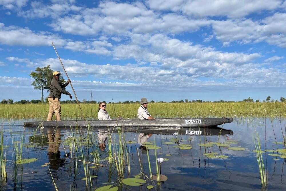 People on a canoe ride through the wetlands in Botswana.