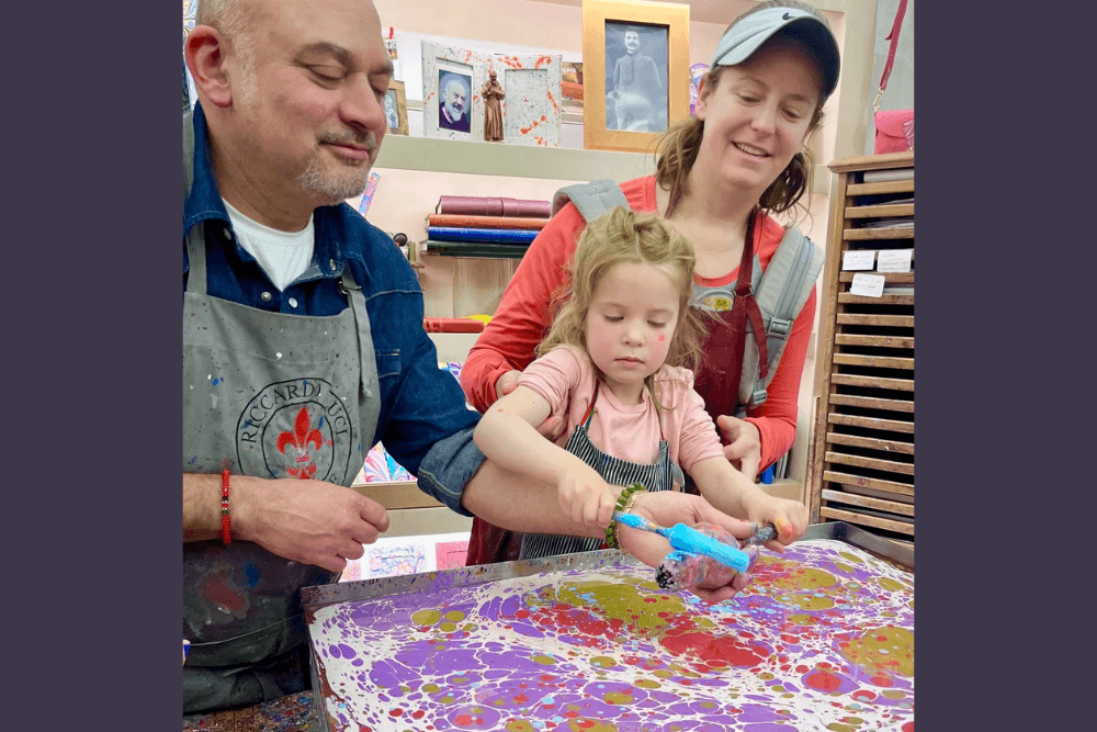 Matilda Pickens making marveled paper with her mother Caroline Reuter and Riccardo Luci in Florence, Italy.