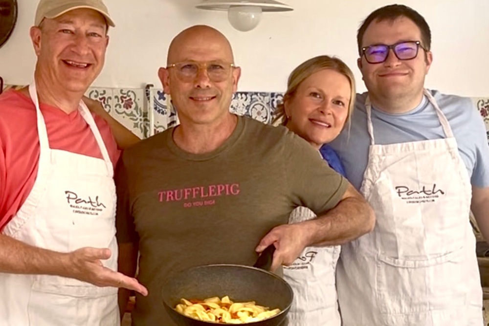 Michael and Jennifer Kelberman and their son during a pasta making class in Puglia, Italy.