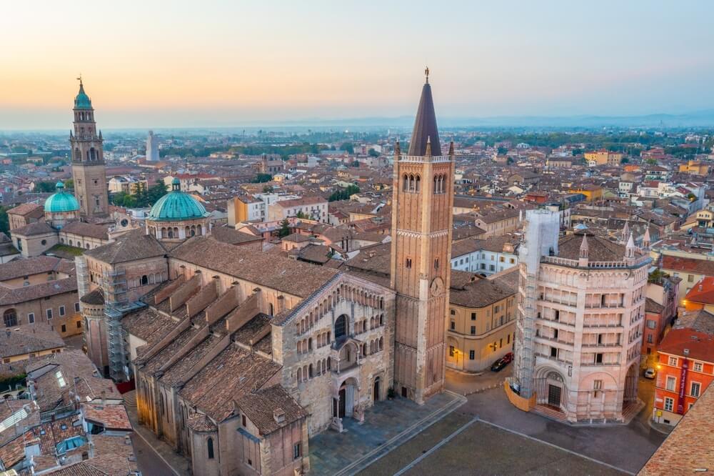 Aerial view of a cathedral during sunrise in Parma, Italy.