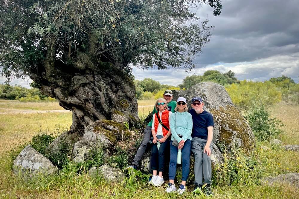 Barbara Fierman with her husband and friends walking the grounds of Sao Lourenco do Barrocal in Portugal.