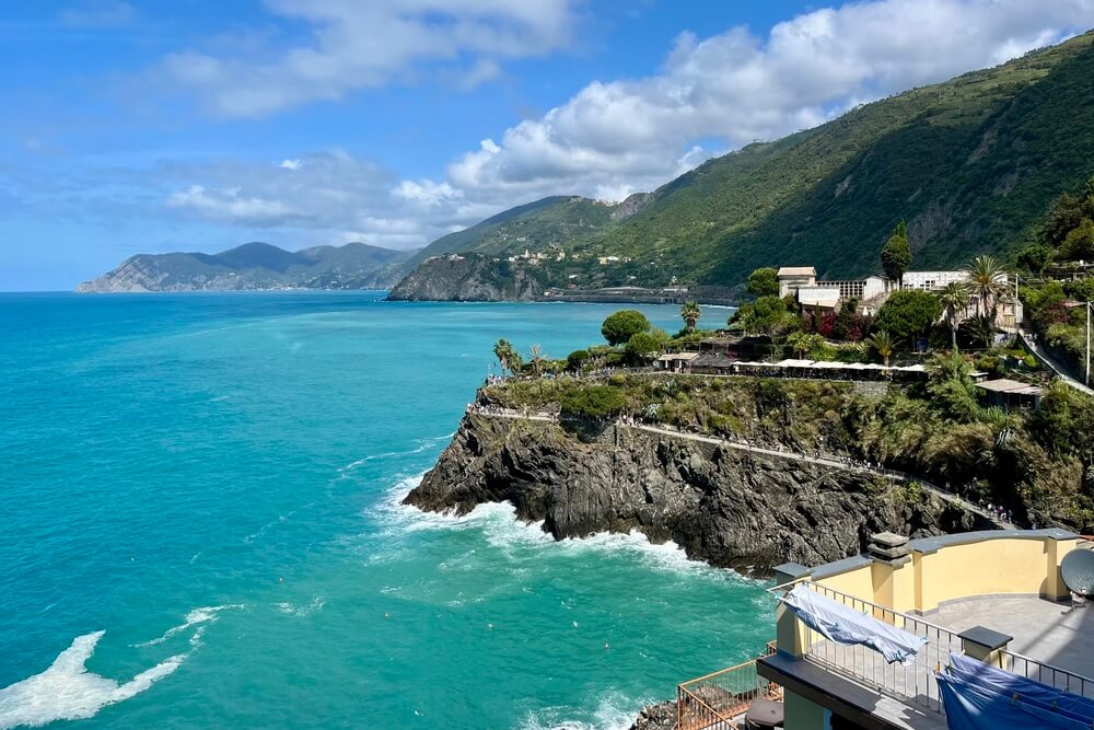 Turquoise waters and rugged cliffs along the Cinque Terre coastline on the Italian Riviera.
