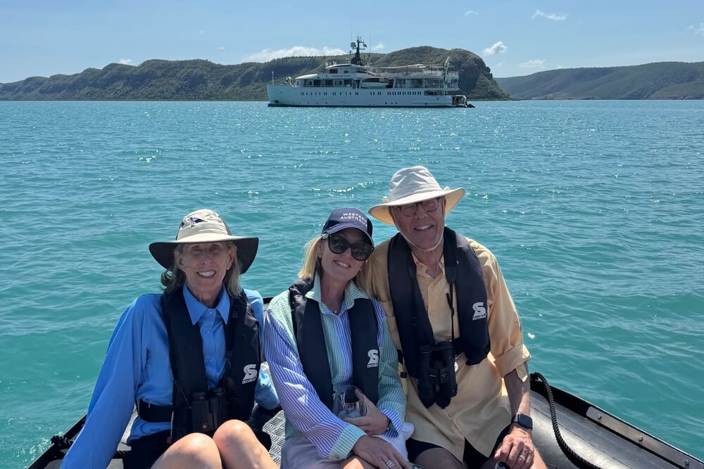 John and Susan Mueller with their trip planner Jacki Lang on zodiac boat in Australia.