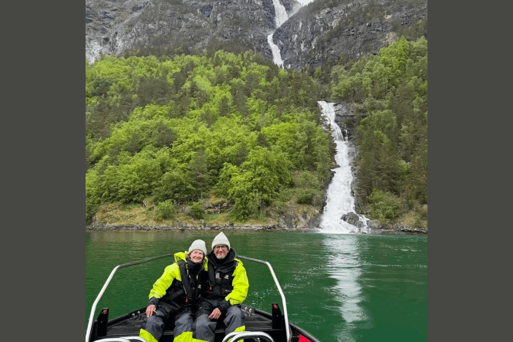 Kim and Jeff Berman on a RIB boat touring waterfalls in the fjords of Norway.