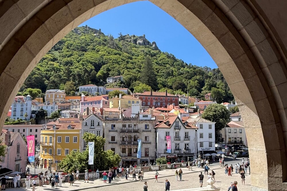 Sintra’s historic center seen from the stone arches of the Sintra National Palace.