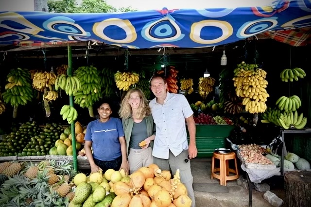 Tracy Reller and her husband at a fruit market in Sri Lanka.